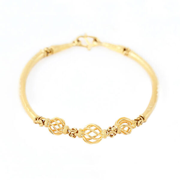 Gold bracelet isolated on white background