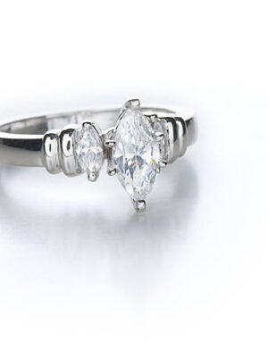 A contemporary diamond ring with a marquise shape center stone.